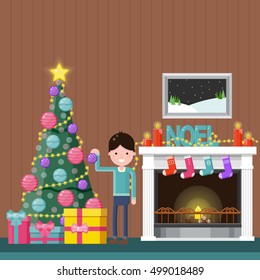 Happy boy decorating the Christmas tree near a fireplace at home. Color flat vector illustration.