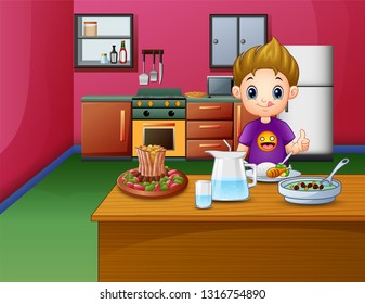 Happy boy eating at the dining table