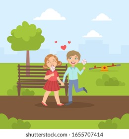 Happy Boy and Girl Walking in the Park and Eating Lollipops, Friendship and Love Between Kids, Happy Valentine Day Vector illustration