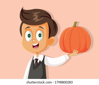 Happy Boy Holding Pumpkin Waiting for Autumn Season. Funny smiling child with squash vegetable decoration
