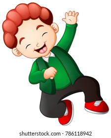 Happy boy jumping in green clothes