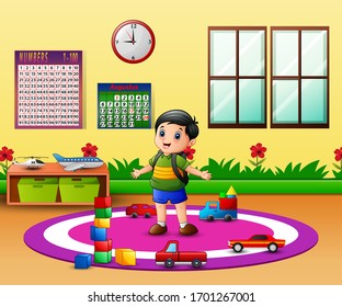 Happy boy in the kindergarten classroom