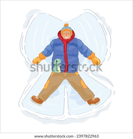 Happy boy making snow angel on winter day 