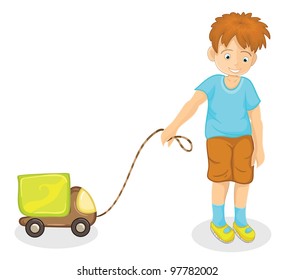 Happy boy playing with the green car