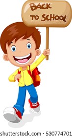 Happy boy running while carrying a sign that read back to school