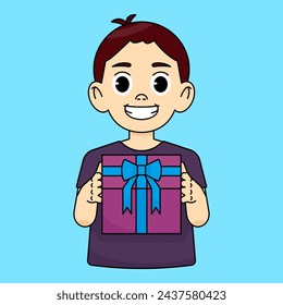 Niño feliz que sonríe y que sostiene la caja de regalo con el arco azul