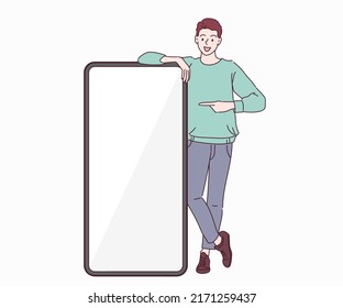 Happy boy standing by huge smartphone with blank screen, mockup, pointing at advertisement. Hand drawn in thin line style, vector illustrations.