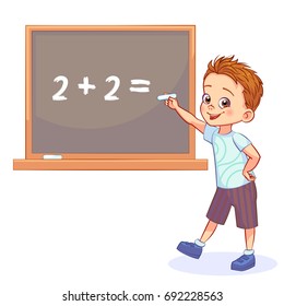 Happy boy is standing by the school board with chalk in his hand. Funny mathematical illustration.