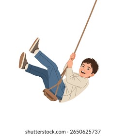 Happy boy swinging on a rope swing.