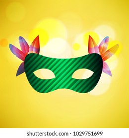 Happy Brazilian Carnival Day. green carnival mask on yellow background