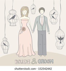 Happy bride and groom in wedding dress and suit with bird cages on background