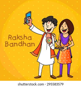 Happy brother and sister taking selfie with smartphone on yellow background for Indian festival, Raksha Bandhan celebration.