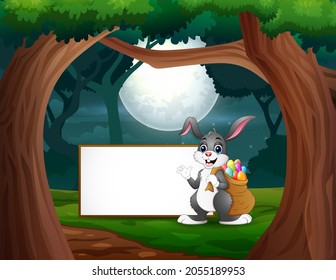 Happy a bunny standing near the blank sign at night