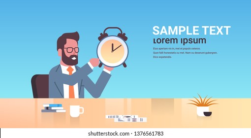 happy businessman holding alarm antique clock business man sitting workplace desk deadline time management concept male cartoon character portrait flat copy space