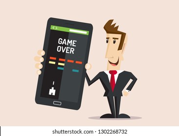 Happy businessman holds big smartphone with video game and game over on the screen