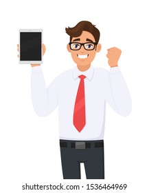 Happy businessman showing new tablet computer and making or gesturing raised fist for success. Person holding a digital tab. Male character illustration. Modern technology in vector cartoon style.