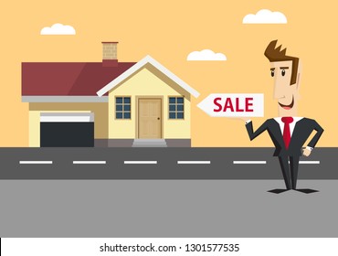 Happy businessman stands beside the house next to the road and holds sale sign