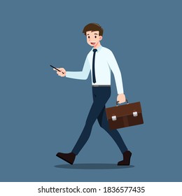 Happy businessman walking and look at smartphone. Business people holding cell phone & walk to work. Office worker moving forward with a mobile phone to play social media during route to the office.