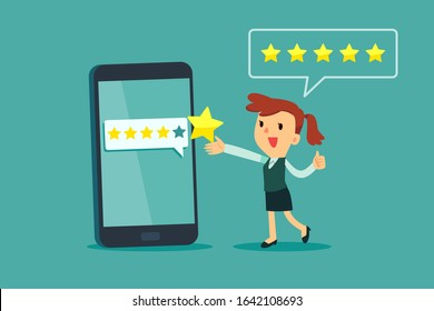 Happy businesswoman give five star rating on smartphone screen. Customer review business concept.