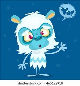 Happy cartoon bigfoot with speech bubble. Halloween vector yeti character with white fur and horns isolated on blue background