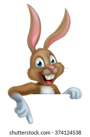 A happy cartoon Easter bunny rabbit pointing down