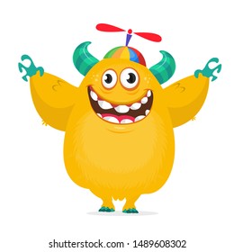 Happy cartoon monster wearing funny cap . Vector illustration