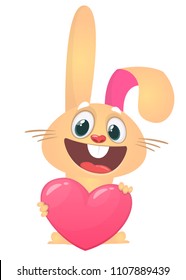 Happy cartoon rabbit holding a heart. St. Valentine's Day. Vector illustration of a smiling bunny