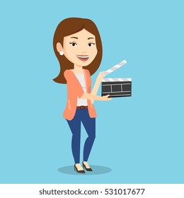 Happy caucasian woman working with a clapperboard. Smiling woman holding an open clapperboard. Cheerful woman holding blank movie clapperboard. Vector flat design illustration. Square layout.