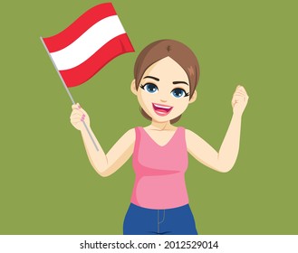 Happy cheerful smiling young Austrian woman holding Austria Flag on green background