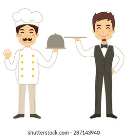 Happy chef holding silver tray and young waiter