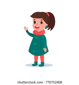 Happy Child In Autumn Checkered Coat, Boots, Scarf And Pants. Girl Character Standing, Waving Hand And Saying Hello. Fashion Little Kid. Flat Vector Design.