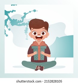 A happy child boy sits in a lotus position and holds a gift box with a bow in his hands. Holidays theme. Vector illustration in cartoon style.