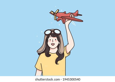 Happy childhood and games concept. Young smiling girl in goggles standing with toy plane in hands and playing imagining her pilot vector illustration 