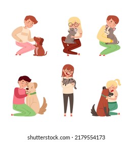 Happy children lovingly embracing their pets set. Boys and girl holding cats and dogs in their hands cartoon vector illustration