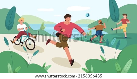 Happy children play in public park. Kids riding a bicycle and running. Fun boys playing ball on green grass lawn near lake. Run, leisure games and sports activities at weekend. Friends on outside walk