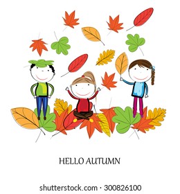 Happy children playing in the autumn leaves
