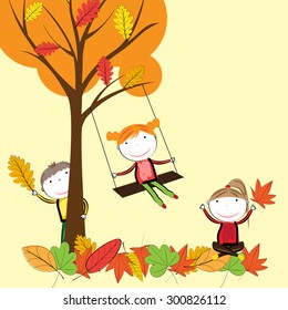 Happy children playing in the autumn leaves
