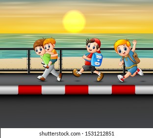 Happy children running on the road near the sea
