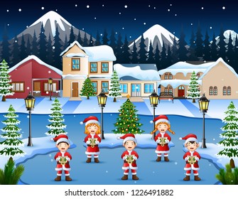 Happy children singing christmas carols in winter night landscape
