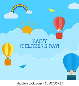 Happy Children's Day greeting card design with cute kids flying in hot air balloons with rainbow on sunny paper cut cloudy background.