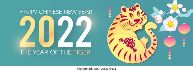 Happy Chinese New Year, 2022 the year of the Tiger.Tiger characer and flowers. Chinese text means The year of the Tiger