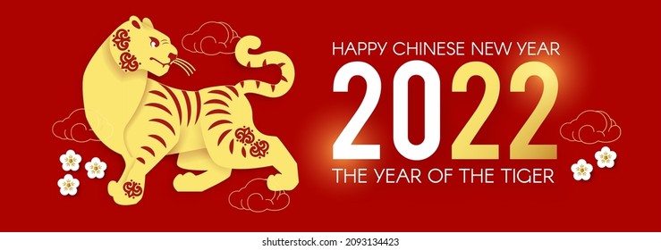 Happy Chinese New Year, 2022 the year of the Tiger.Tiger characer and flowers. Chinese text means The year of the Tiger