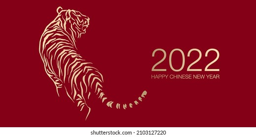 Happy Chinese New Year 2022 by gold brush stroke abstract paint of the tiger isolated on red background.