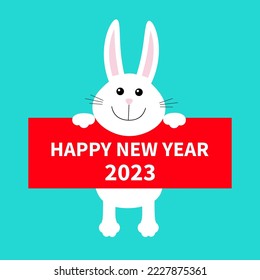 Happy Chinese New Year 2023. The year of the rabbit. White bunny hanging on paper board. Paw print. Big ears. Cute cartoon character. Kawaii animal. Baby card. Flat design. Blue background. Vector