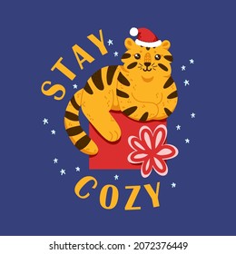 Happy Chinese new year holiday Stay Cozy card 2022 with a cute tiger in Santa hat and a huge gift with a bow. Animal holidays cartoon character vector postcard