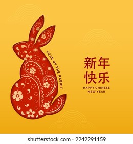 Happy Chinese New Year Mandarin Text With Paper Cut Zodiac Rabbit On Orange Background.