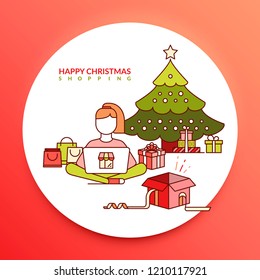 Happy Christmas shopping. A girl shopping online Christmas gifts next to a Christmas tree with bags and gifts in green and red colors.