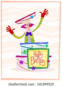 happy clown wearing colorfull costume jumping out of birthday cake and giving a happy birthday greeting