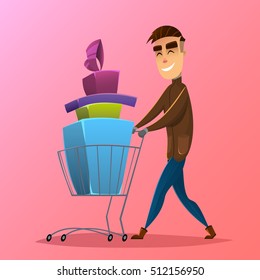 Happy consumer with  shopping cart full of christmas and new year gifts and boxes . Yong handsome smiling men  at the shopping . Christmas sale concept .