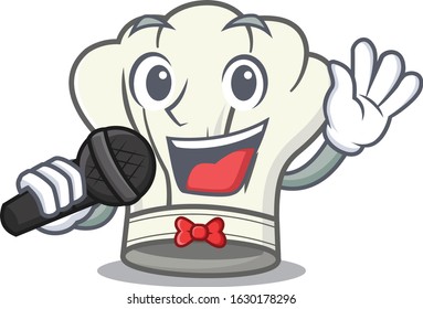 Happy cook hat singing on a microphone